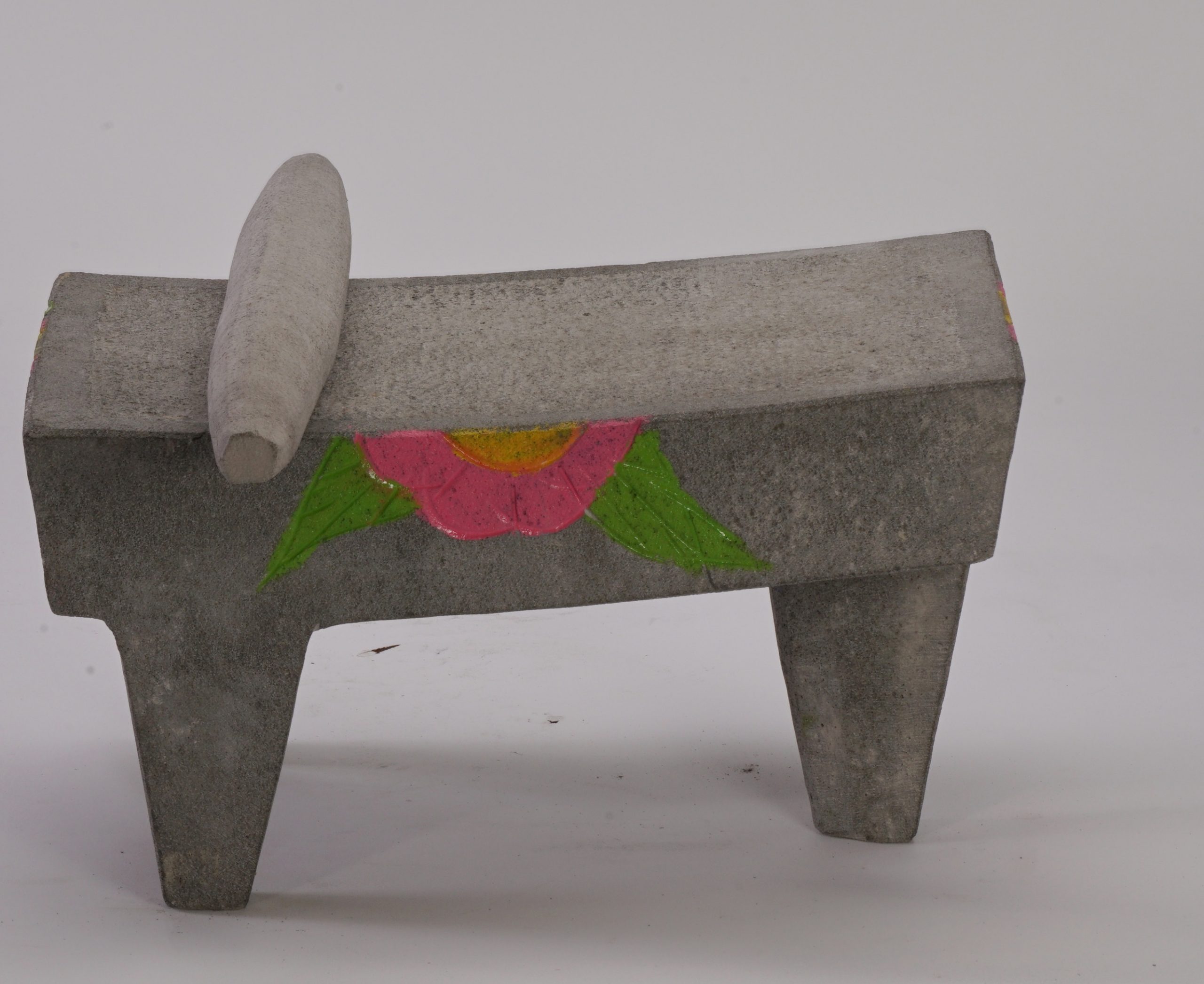 Stone metate with flower